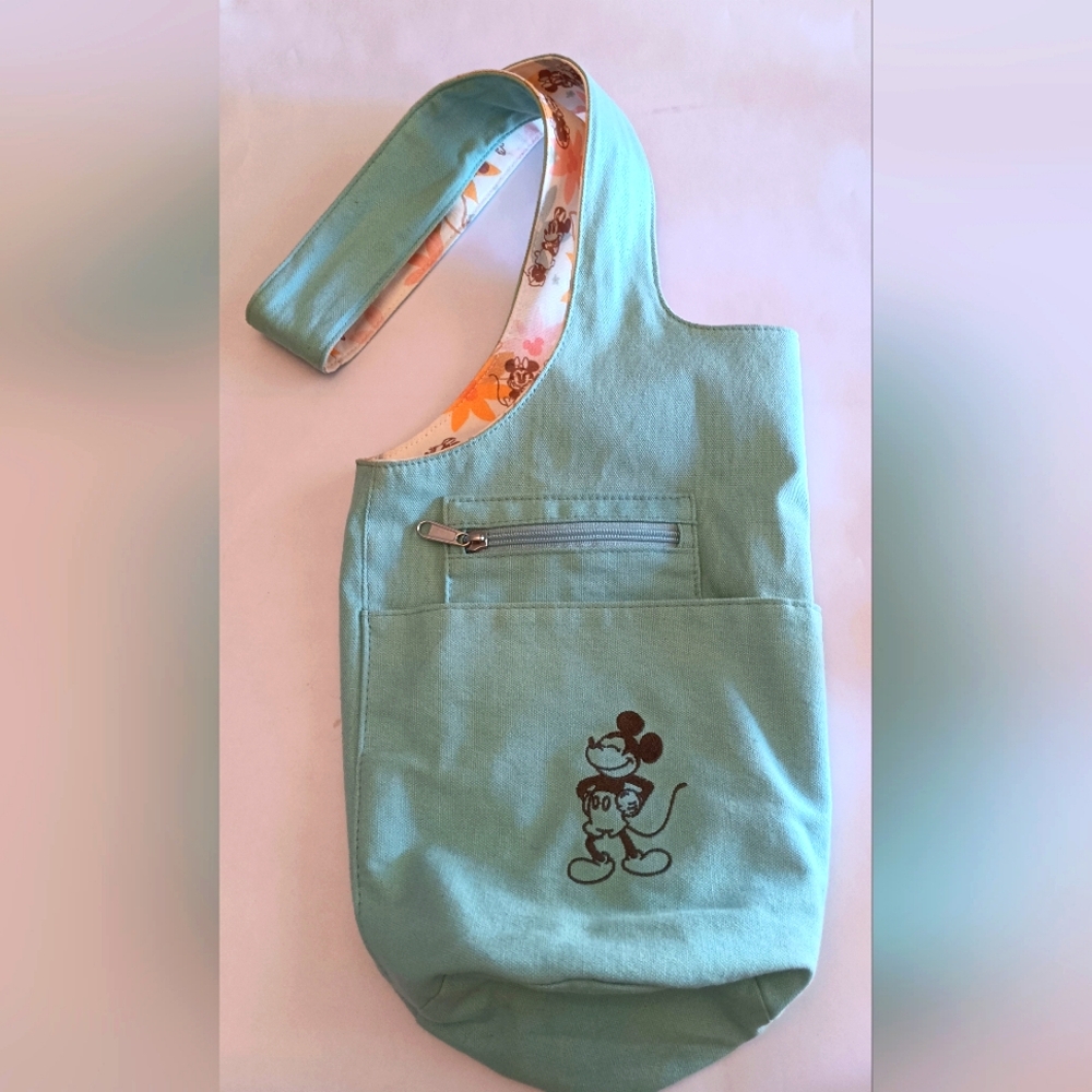 Disney's Mickey Blue/Floral Reversible Sling Bag Newer Release Pre-owned